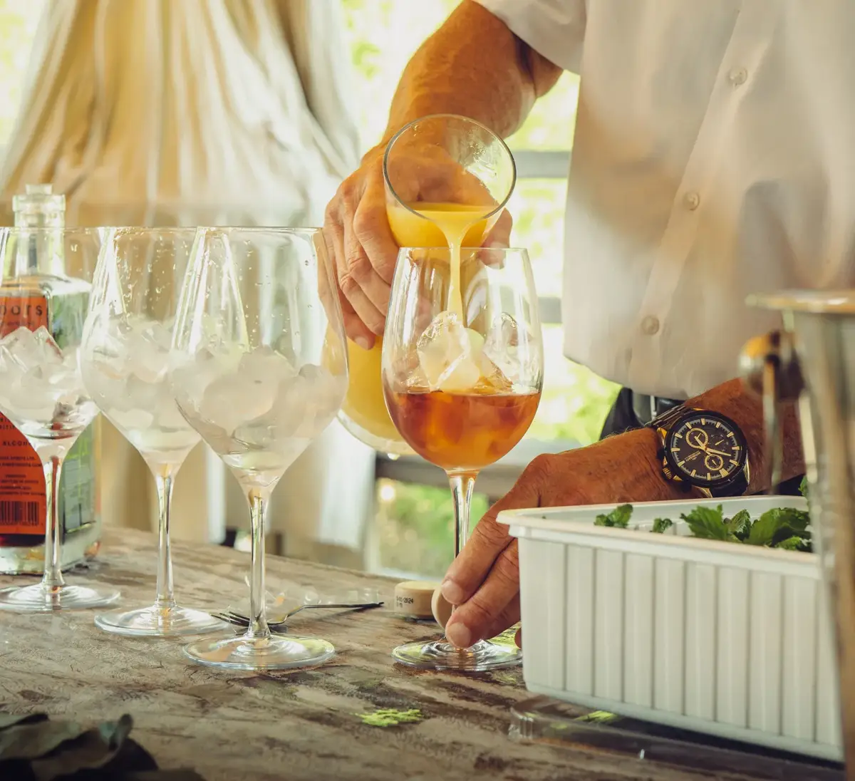 Bartender pouring a craft cocktail