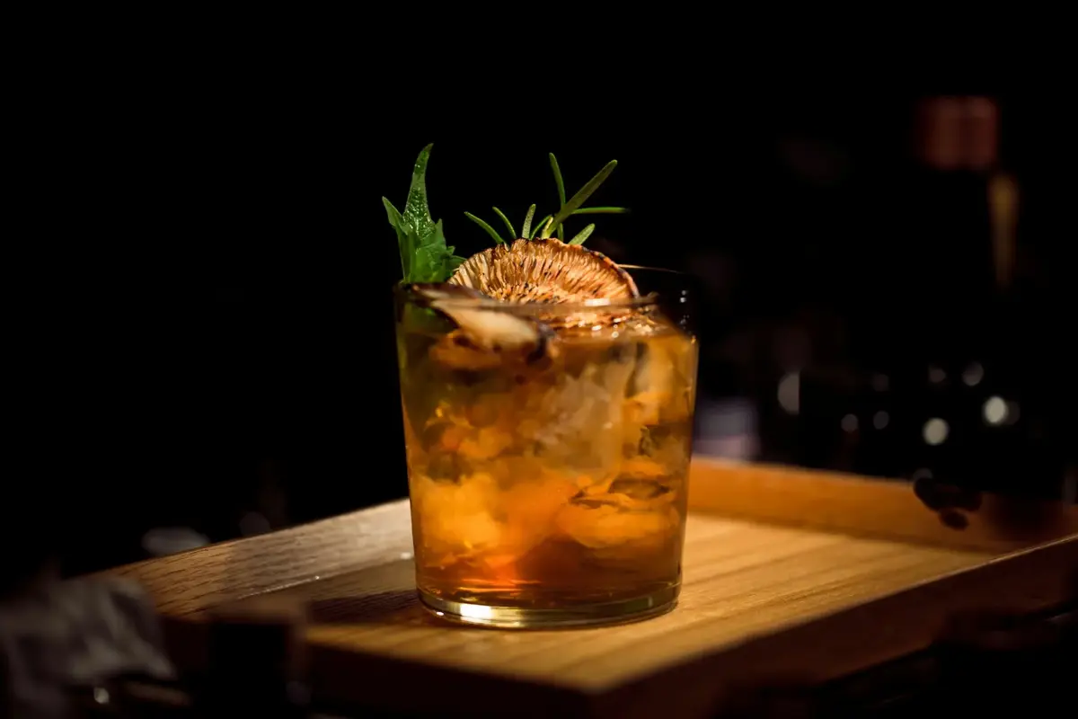Bourbon cocktail garnished with rosemary